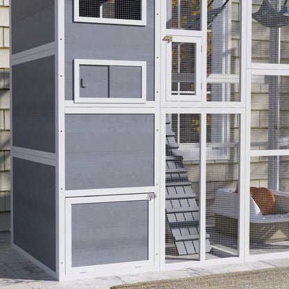 Outdoor wooden cat enclosure with condo and hammock