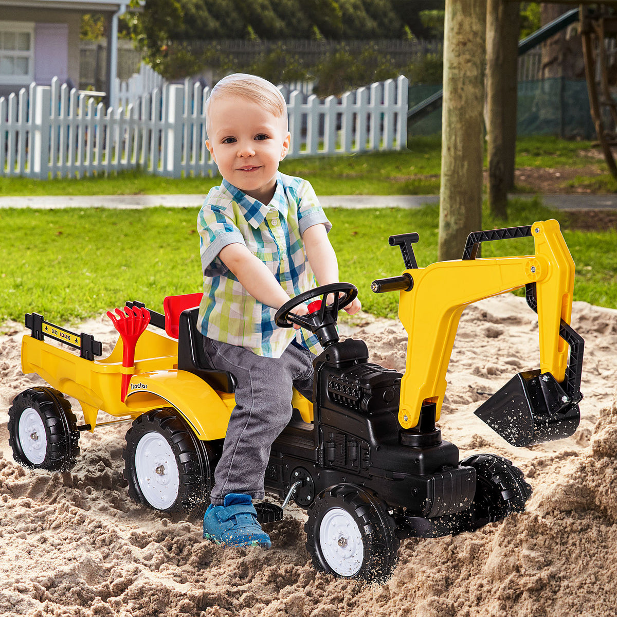 Tractor de pedales con brazo excavador y remolque