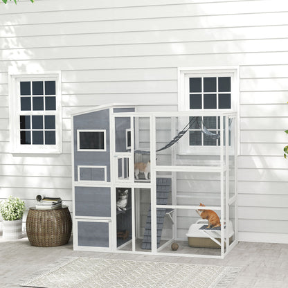 Outdoor wooden cat enclosure with condo and hammock
